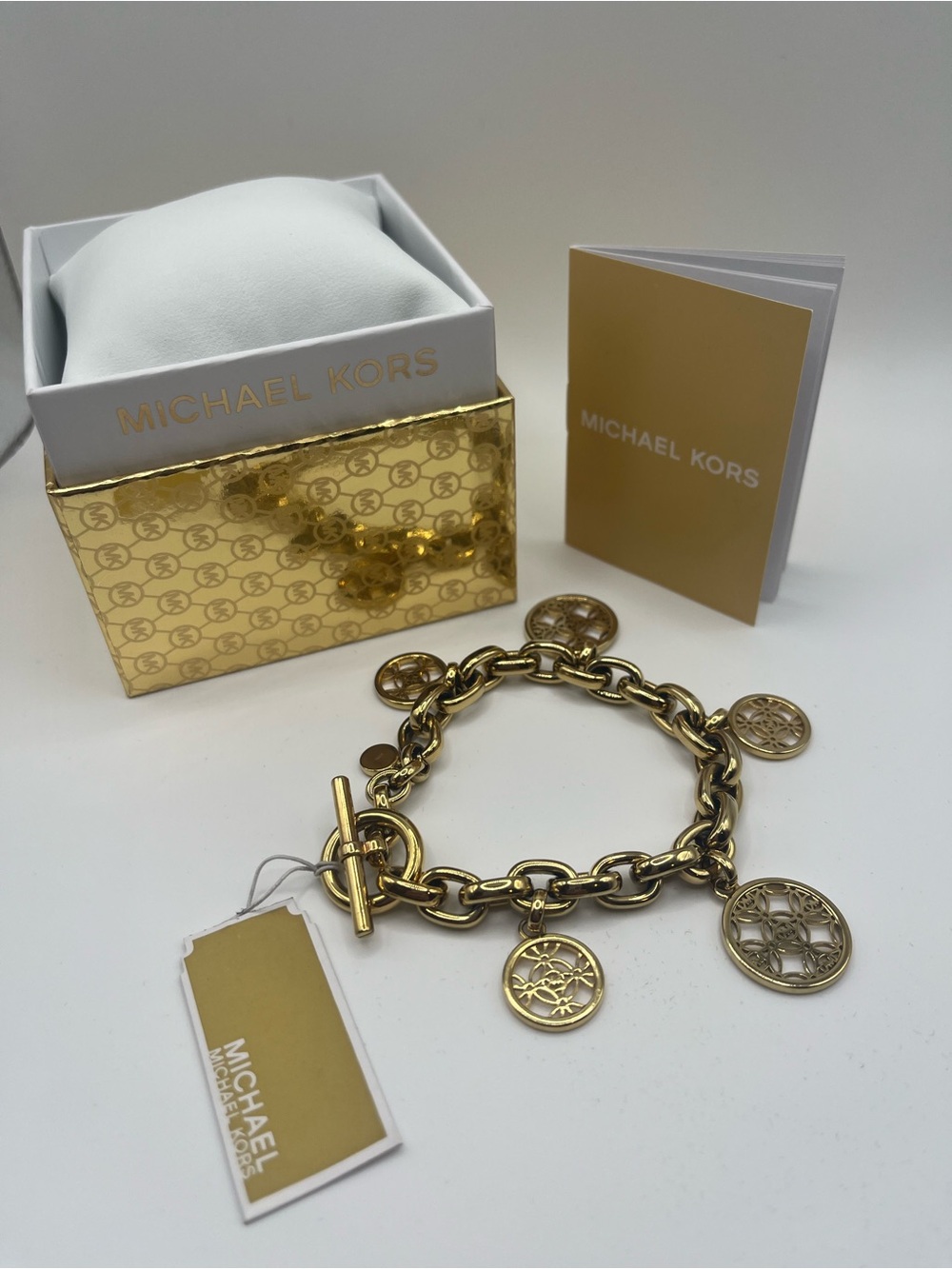 Michael Kors Gold Tone Charm Toggle Bracelet MK Logo Medallion NWT in Box